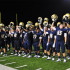 Tigers hold up their helmets after they put there all into the game.