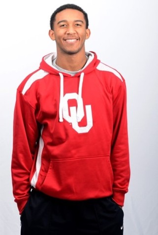 Senior Jordan Thomas wears his new Oklahoma University with pride.